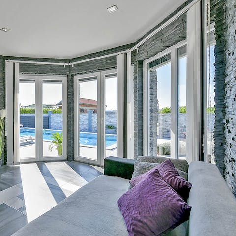 Get comfortable in the light-filled living spaces after a day at the beach