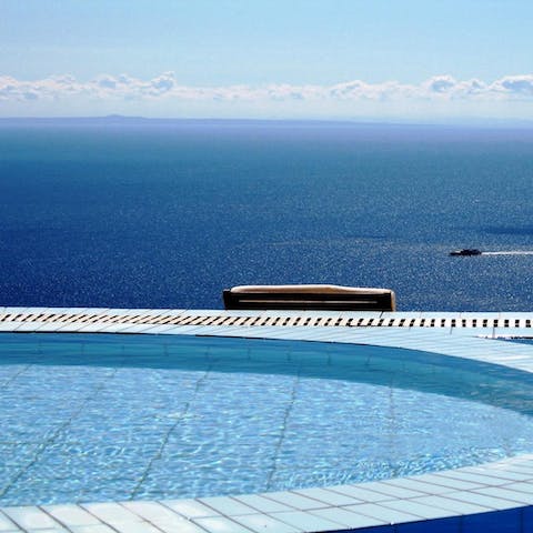 Soak in the hot tub as you admire the sea view