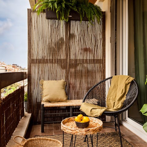 Watch the sunset over the city with a glass of wine on the balcony