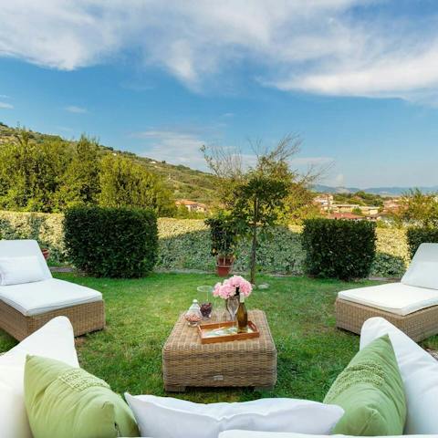 Relax in the pristine garden with a glass of Chianti