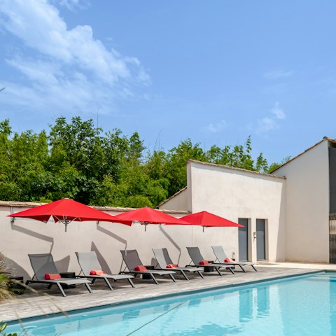 Stretch out in the sun by the poolside
