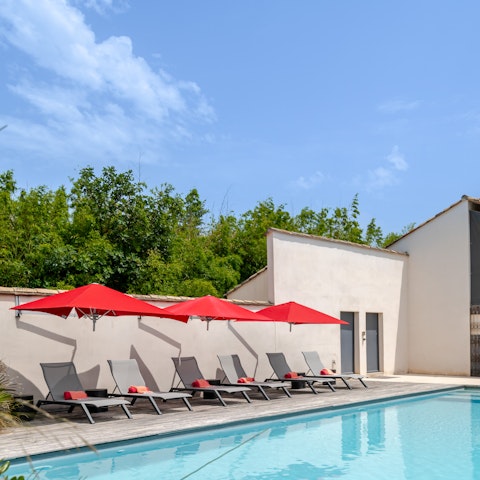Stretch out in the sun by the poolside