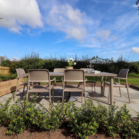 Enjoy a glass of cider in the large garden