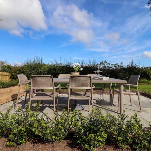 Enjoy a glass of cider in the large garden
