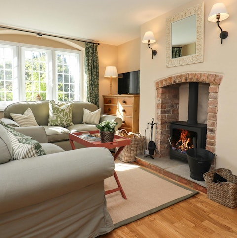 Relax in the living room next to the log burner when the Gloucestershire weather turns cold