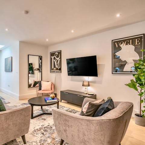 Come together in the chic living space with trendy prints and plush seating