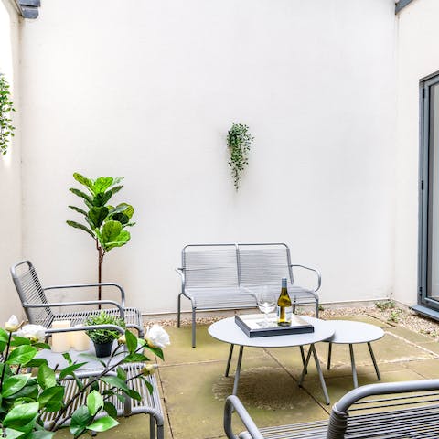 Gather your ensemble for a games night on the private patio