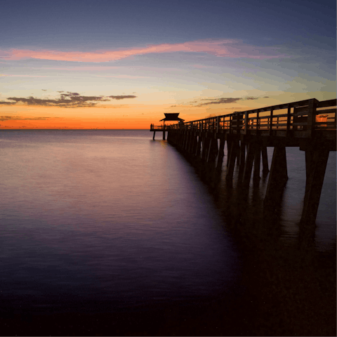 Soak up the scenic sunset views from Naples Pier