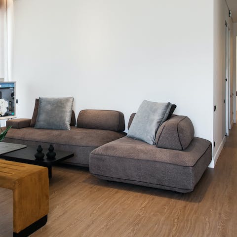 Relax on the plush sofas after a day on the beach or exploring, choosing between your book or Netflix