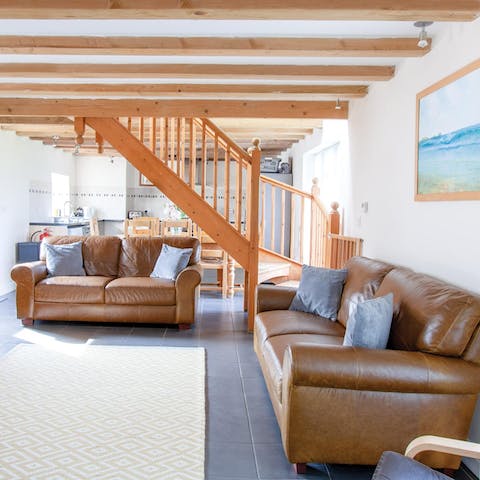 Get comfortable on the buttery leather sofas for a cosy night in