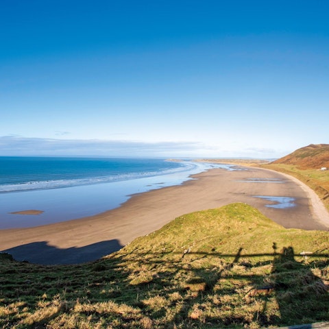 Take a walk along Rhossili Beach – it's roughly a ten-minute drive away
