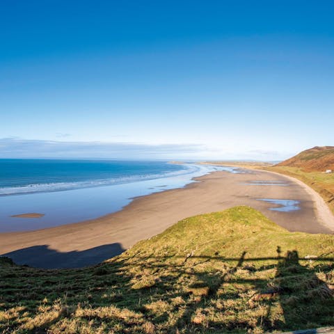Take a walk along Rhossili Beach – it's roughly a ten-minute drive away