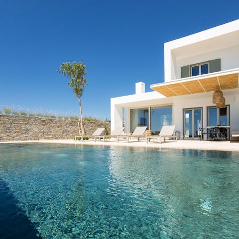 Dip in the glistening aquamarine pool when the Greek heat gets too much