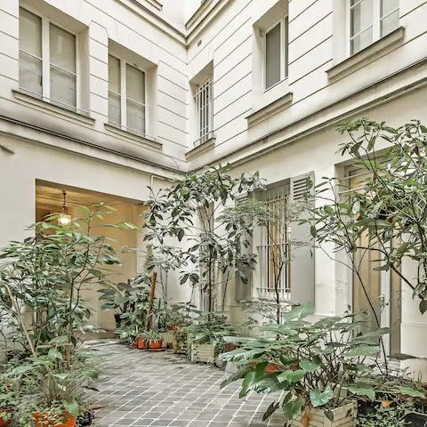 Enter your building through a mass of lush greenery