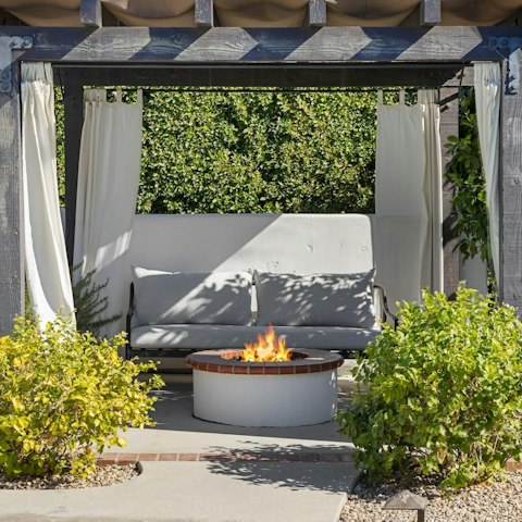 Gather for magical evening drinks by the fire pit