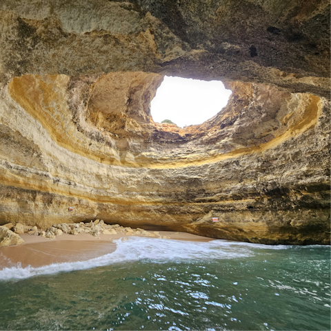 Take a boat ride to the famous Benagil Cave nearby