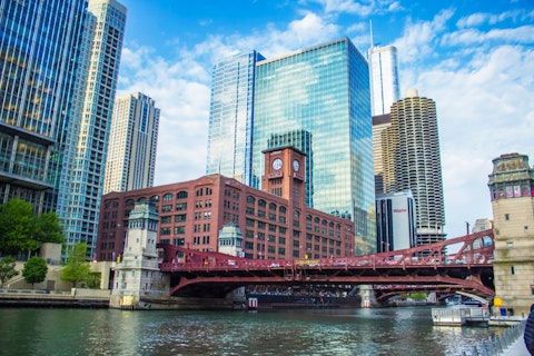 Walk the Chicago Riverwalk, a vibrant waterfront lined with bars and restaurants