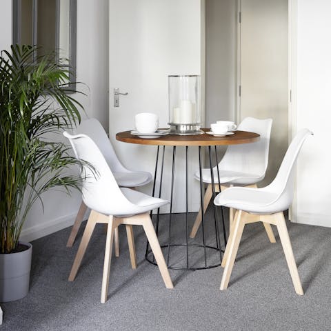 Gather around the chic table to enjoy a home-cooked meal