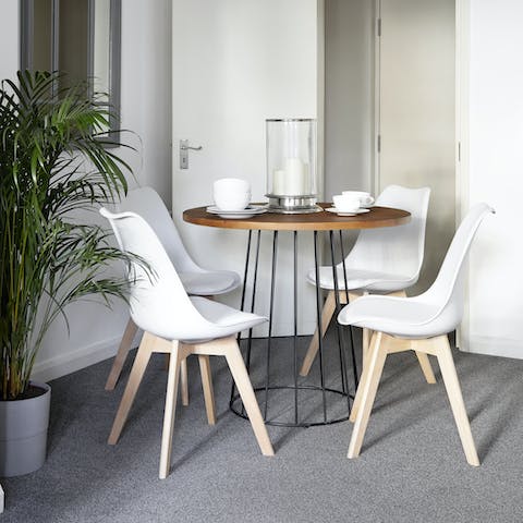 Gather around the chic table to enjoy a home-cooked meal