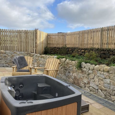 Crack open up a bottle of something fizzy and enjoy a glass from the bubbling water of the hot tub