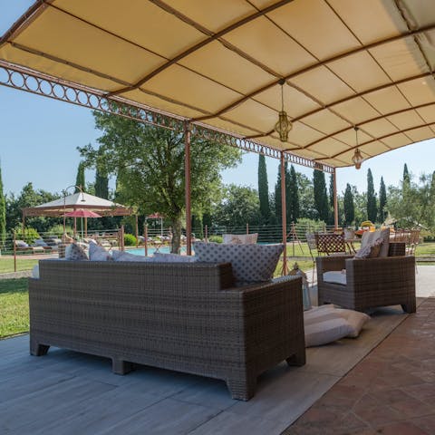 Relax with a cup of coffee on the patio in the shade