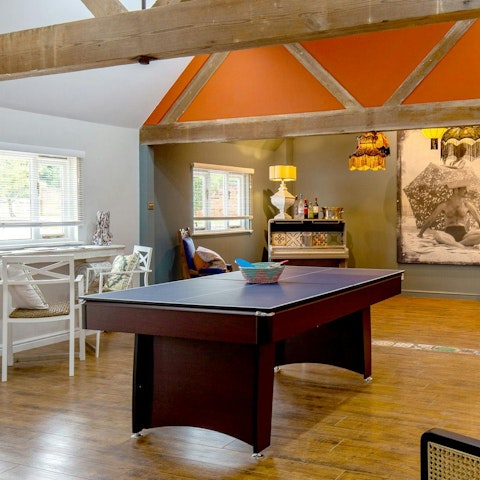 Play darts, ping pong, and even the piano in the separate games room