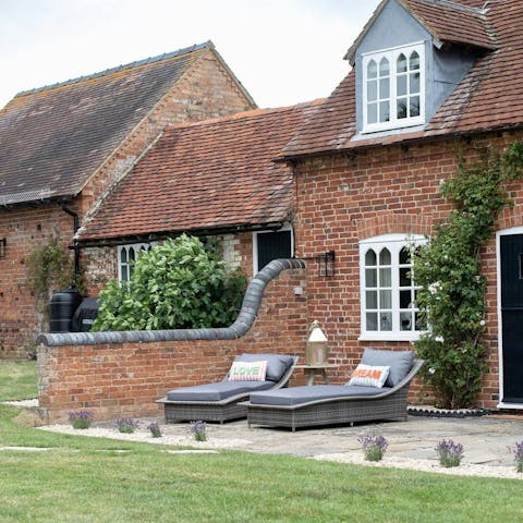 Enjoy a moment of calm overlooking the expansive garden