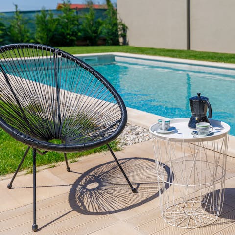 Enjoy sipping your morning coffee next to the swimming pool