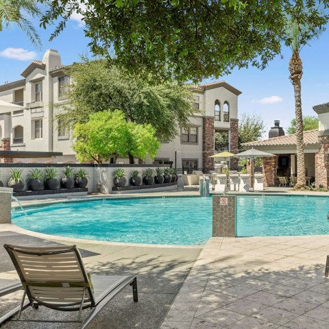 Stretch out on a sun lounger beside the communal pool
