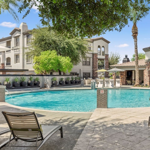Stretch out on a sun lounger beside the communal pool