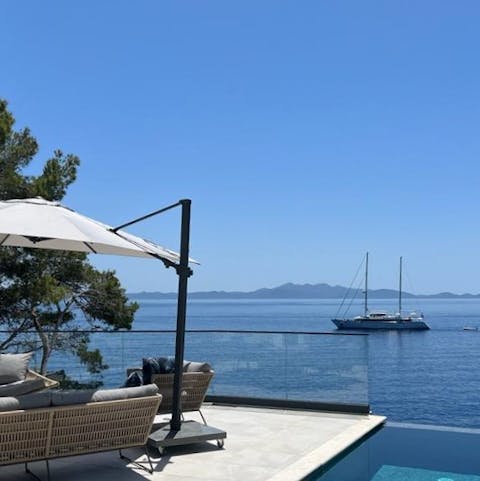 Watch boats glide by from the myriad terrace and private balconies