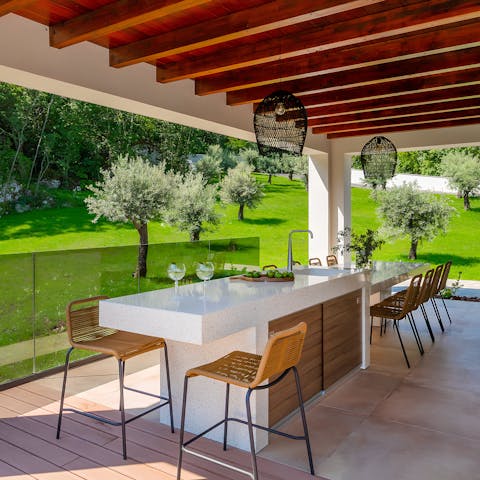 Whip up a dish in the sleek outdoor kitchen