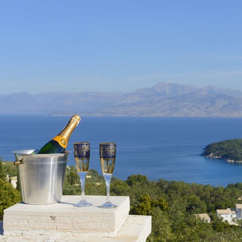 Raise a glass to relaxation and gaze out towards the Albanian coast