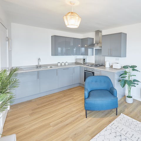 Whip up light bites in the sleek and modern kitchen