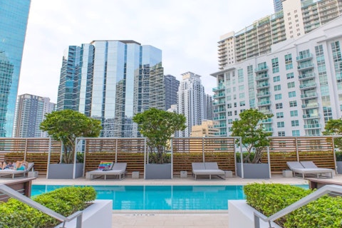 Cool off in the communal pool with Miami's skyline all around