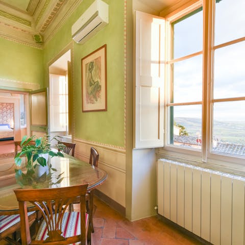 Look out at views of the Tuscan landscape out through the large windows as you dine