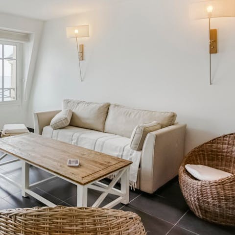 Lounge about in the comfy living room, enjoying a movie and a glass of cider