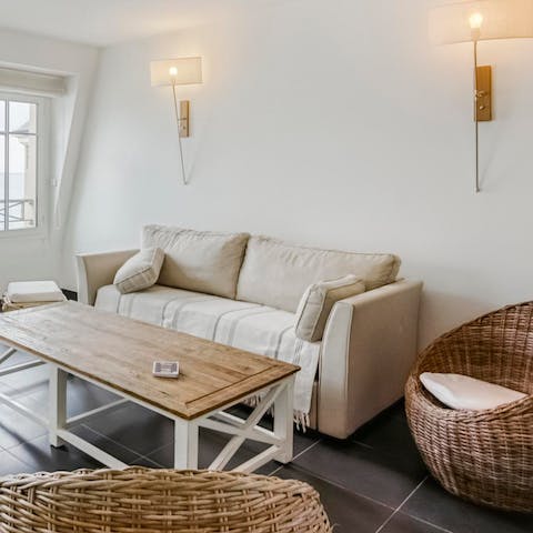 Lounge about in the comfy living room, enjoying a movie and a glass of cider