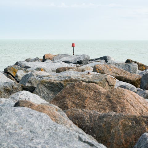 Traverse the rocks at Hythe beach, just a thirty–eight–minute drive away