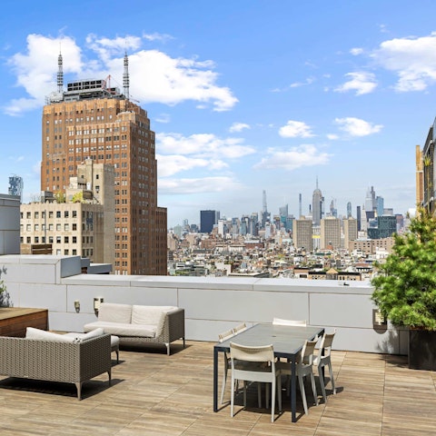 Marvel at the skyline from the shared rooftop terrace