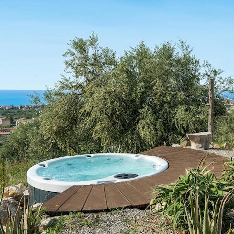 Enjoy sea views from the hot tub