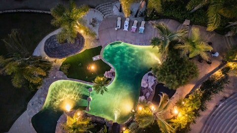 Enjoy a midnight dip in the floodlit pool edged by palms