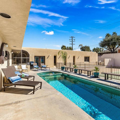 Cool off in the pool after playing tennis on the full-size court