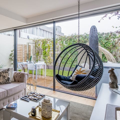 Chill out in the bright living room with a glass of wine after a day of Porto sightseeing