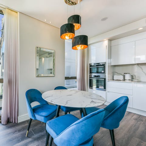 Gather together for a celebratory meal at the chic dining table