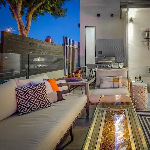 Spend alfresco evenings sipping wine by the fire pit and cooking on the barbecue