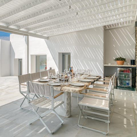 Dine alfresco under the pergola, supported by a spectacular view