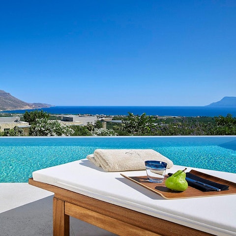 Lounge on the day beds in the sun in front of views over Kissamos Bay