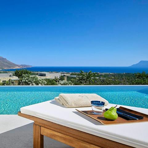 Lounge on the day beds in the sun in front of views over Kissamos Bay