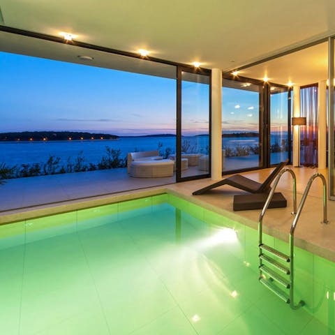 Take an evening dip in the pool as the sun sets over the Adriatic